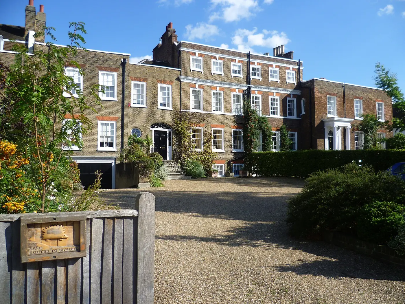 Georgian brick houses behind front gardens in Dulwich Village